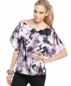 Romantic and totally flirty, BCX's printed top blooms with rosettes at the collar!