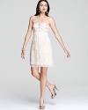 A beaded satin bodice tops a delicate lace skirt on SW Studio by Sue Wong's embroidered, strapless dress.