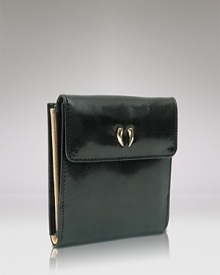 Give into practical accessorizing with this patent Italian leather wallet from Tusk. It's profile is pocket perfect, while a glossy exterior lends polish. Give into practical accessorizing with this patent Italian leather wallet from Tusk. It's profile is pocket perfect, while a glossy exterior lends polish.