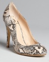 Sensual curves combined with snakeskin-embossed uppers set this pair of Kelsi Dagger pumps apart: Exotically appealing.