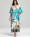 Infuse your at-home wardrobe with glamorous style in Natori's flowing, floral-print caftan.