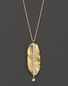 This shining gold leaf, set with sparkling diamonds, evokes early autumn mornings.