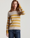 Cheerful yellow straps race across this soft knit sweater from Burberry.