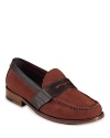 Cole Haan's handsewn penny loafer is crafted in supple suede, with Nike Air™ technology in the heel for superior support.