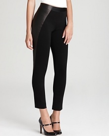 Asymmetric panels in luxe lamb leather lend edge to Elie Tahari's slim-legged Jolene pants.