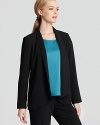 Body-con tailoring and an angled hem give this Eileen Fisher blazer a super-feminine feel. Slip the style over cocktail dresses for a punch of modernity.