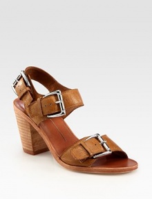 Oversized buckles and an adjustable slingback strap characterize this supple leather design. Stacked heel, 3 (75mm)Leather upperLeather lining and solePadded insoleImported