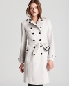 This iconic Burberry London trench coat is rendered in rich wool and features finely appointed details like designer-embossed buttons, military-inspired epaulets and a signature check lining. Refined enough for the workday, but chic enough for evening-this is the fashion investment your winter wardrobe has been wanting for.