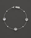 Stations of diamonds and clear quartz dot a sterling silver chain. By Ippolita.