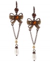 Wrapped up quite nicely. These drop earrings from Betsey Johnson with a bow motif are crafted from mixed metal with topaz and pearl tones enhancing the appeal. Approximate drop: 3-1/4 inches.