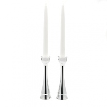 Recite your Sabbath blessings in the presence of candles lit in this pair of noble, clean-lined candleholders. The sticks rise triumphantly to cup and hold the candles and the dancing light reflects off the metal. Individual artists use Nambe, a superior metal alloy that retains heat and cold. Candleholders stand 8 high. Recite your Sabbath blessings in the presence of candles lit in this pair of noble, clean-lined candleholders. The sticks rise triumphantly to cup and hold the candles and the dancing light reflects off the metal. Individual artists use Nambe, a superior metal alloy that retains heat and cold. Candleholders stand 8 high.