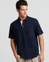 A deep navy polo from Michael Kors with a contrast three button placket--a comfy weekend essential.