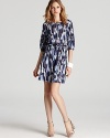 Julie Dillon's feather printed dress lends low-key chic in a shift silhouette--a belted waist gives a flattering fit.