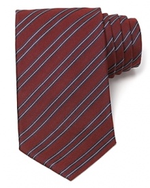 Maintain your polished appearance with this dignified silk tie, cut in a classic width for traditional appeal and patterned with a handsome stripe design. Maintain your polished appearance with this dignified silk tie, cut in a classic width for traditional appeal and patterned with a handsome stripe design.