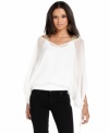 Dreamy chiffon creates a floaty outer layer on this top from Baby Phat, while beaded shoulder straps add a hint of glam!