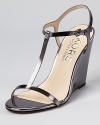 Modern and minimal, these sleek wedges from KORS Michael Kors boast clean lines on a simple silhouette.