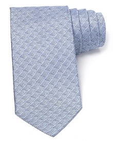 A textural pattern tie in an understated color resolves your workday attire with simple refinement. A textural pattern tie in an understated color resolves your workday attire with simple refinement.