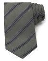Maintain your polished appearance with this dignified silk tie, cut in a classic width for traditional appeal and patterned with a handsome stripe design.