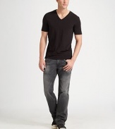 A relaxed fit with modern sensibilities, rendered with flap pockets in black denim that's been washed down to a dark grey finish. Five-pocket style Zip fly Stitched flap back pockets Inseam, about 34 Cotton; machine wash Made in USA