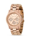 MICHAEL Michael Kors classic chronograph three-link bracelet watch in stainless steel. Round rose goldtone dial with Arabic numbers. Three subdials and date display.