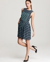Lighthearted and luxe, this MARC BY MARC JACOBS dress flaunts playful pleats on a printed silhouette for spring-perfect style any and every day. Wear it to work with glossy pumps or with ballet flats on weekends--this chic look is a pleaser either way!