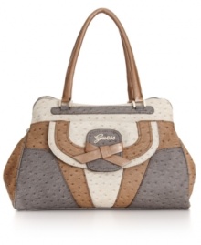 From a long day of shopping to dinner on the town, this ostrich skin print satchel by GUESS will keep your style on point. This design gets in touch with its feminine side with a rhinestone detailed logo and bow accented front. From a long day of shopping to dinner on the town, this ostrich skin print satchel by GUESS will keep your style on point. This design gets in touch with its feminine side with a rhinestone detailed logo and bow accented front.