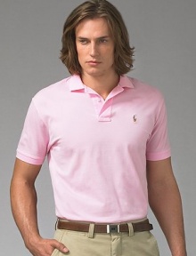 A year-round essential, the iconic polo in soft mercerized pima cotton has a gentle fit for the ultimate in comfort. Mercerized yearns for smooth hand and subtle luster Two-button placket Ribbed polo collar and armbands Multi-color polo detail at chest Silk grosgrain taping at split hem Machine wash Imported