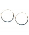 Tiny beads make a big statement on this pair of hoop earrings from Kenneth Cole New York. The silver and blue cherry beads adorn the earrings crafted from gold-tone mixed metal for a stunning look. Approximate drop: 2-1/4 inches.