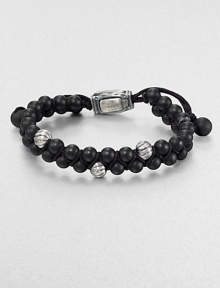 From the Spirited Bead Collection, this two-row beaded bracelet is handsomely crafted from 6mm black onyx beads, featuring three sterling silver cable beads and an adjustable clasp.Sterling silverBlack onyxAbout 9 longAbout 3 diam.Imported From the Spirited Bead Collection, this two-row beaded bracelet is handsomely crafted from 6mm black onyx beads, featuring three sterling silver cable beads and an adjustable clasp.Sterling silverBlack onyxAbout 9 longAbout 3 diam.Imported