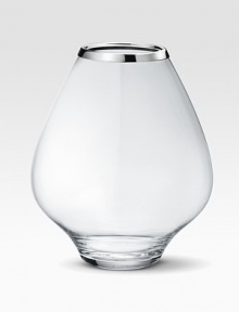 A masterful balance between strength and poetry, handcrafted in glass with a bulb-like shape that does justice to your most artful flower arrangements. From the Grace CollectionGlass with stainless steel rim10½H X 9 diam.Hand washImported