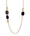 Add a long layer of rich, golden tones and rustic hues to your neckline in Kenneth Cole New York necklace. With brown beads and hammered gold tone discs at the double chain. Crafted in gold tone mixed metal. Approximate length: 28 inches + 3-inch extender. Approximate drop: 1 inch.