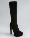 Suede sophistication reaches new heights in Via Spiga's sensational platform boots, with trend-right almond toes.