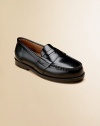 A classic leather slip-on with penny slot creates a retro, handsome look. Slip-on Leather upper Leather sole Padded insole Leather lining Imported