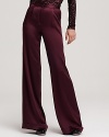 In a regal plum hue and classic cut, these wide leg Alice + Olivia high waisted pants exude easy elegance. A ladylike sequin blouse infuses the look with retro-inspired glamour.