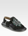 An ornate jeweled embellishment sparkles on this comfortable suede design. Rubber platform, ¾ (20mm)Suede upper with glass beads and rhinestonesAdjustable strapLeather liningRubber solePadded insoleMade in Italy