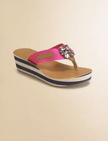 Attractively striped wedge and platform topped with a sparking embellishment in a low-cut thong silhouette.Slip-on styleNylon upperRubber soleImported Attractively striped wedge and platform topped with a sparking embellishment in a low-cut thong silhouette.Slip-on styleNylon upperRubber soleImported