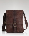 Crafted in soft weathered leather, this smaller messenger bag is perfect for organizing round-town essentials in style.
