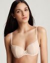 A molded cup balconette bra with mesh wings in a raised dot print.