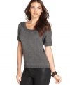 Rendered from sleek metallic knit, Calvin Klein Jeans' short-sleeve sweater is an easy layering piece for fall. Try it with coated jeans for a textured look!