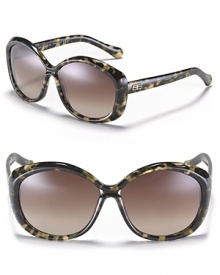 Sleek round oversized sunglasses with signature metal logo detail at temples.