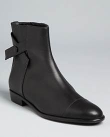 From designer Tibi, these abbreviated boots subtly hit all the season's key style notes, with tonal cap toes and distinctive side straps that set them apart.