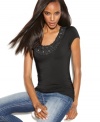 A feminine alternative to your traditional tee – ruffles and rhinestones update this classic top from INC.