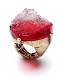 Voluptuous and volcanic. Bar III's red-hot ring features an asymmetrical resin stone in a chic crimson hue. Stretch band and setting is crafted in burnished gold tone mixed metal. Ring stretches to fit finger. Approximate size: 1-1/2 inches.