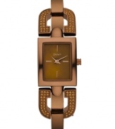 DKNY takes a unique turn with this darling sparkling bangle watch. Crafted of brown ion-plated stainless steel half-bangle bracelet with crystal-accented D-shaped links at rectangular case. Brown dial features rose-gold tone stick indices at three, six, nine and twelve o'clock, two hands and logo at twelve o'clock. Quartz movement. Water resistant to 50 meters. Two-year limited warranty.