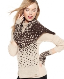 Opt for something fierce in your everyday accessorizing with this leopard print scarf from Calvin Klein. Cozy, chic and sumptuous, it's the perfect addition to any cold day ensemble. Opt for something fierce in your everyday accessorizing with this leopard print scarf from Calvin Klein. Cozy, chic and sumptuous, it's the perfect addition to any cold day ensemble.
