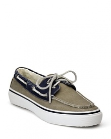 Step into the sunlight in this cool 2-tone boat shoe from Sperry, outfited in canvas with classic lace details and moc toe. Step into the sunlight in this cool 2-tone boat shoe from Sperry, outfited in canvas with classic lace details and moc toe.