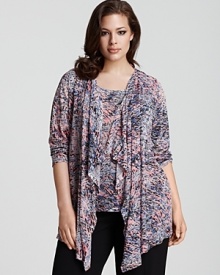Rhinestone accents lend glamour to this flyaway cardigan by Calvin Klein. Rhinestone accents lend glamour to this flyaway cardigan by Calvin Klein.
