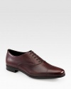 Burnished Italian leather lace-up oxford with a rubber sole. Leather upperLeather liningPadded insoleRubber soleMade in Italy