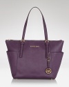 MICHAEL Michael Kors' signature Jet Set tote arrives in saffiano-finished leather with room for the daily essentials. It's so ready for takeoff.
