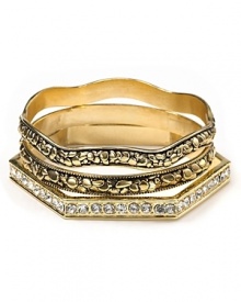 A gold nugget design lends luxe texture to these stacked bangles from Belle Noel. A gold nugget design lends luxe texture to these stacked bangles from Belle Noel.